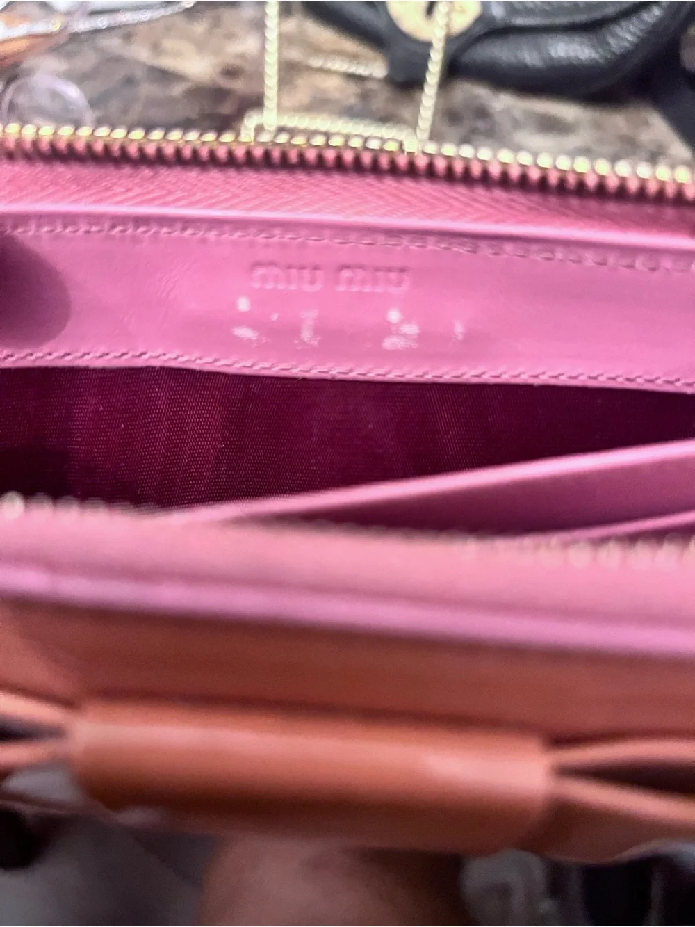 Miu Miu sleek zip